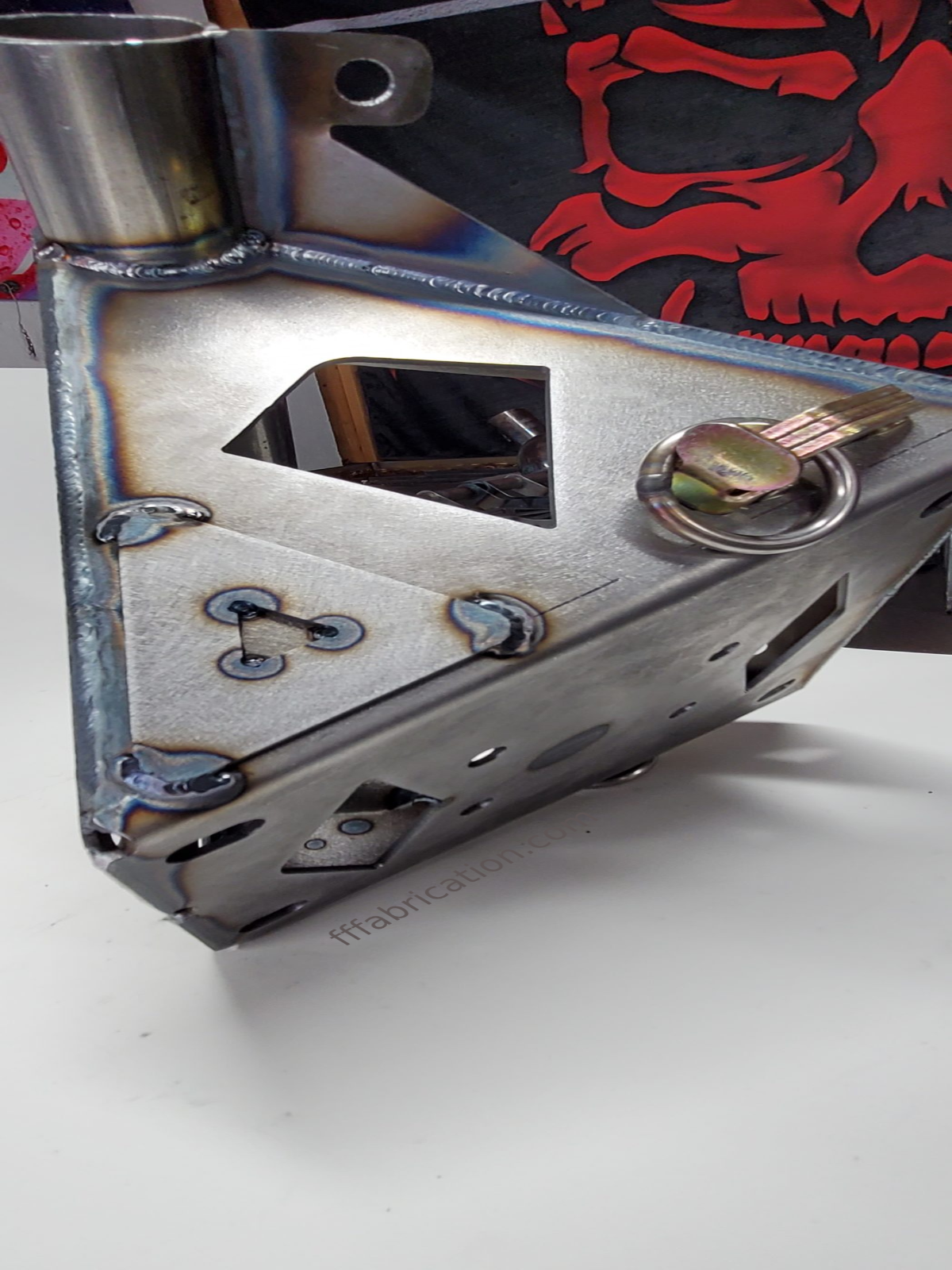 Metal lock mechanism with a red logo on a white background