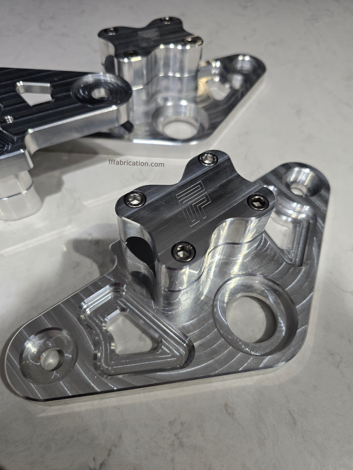 Metal mechanical components on a gray surface
