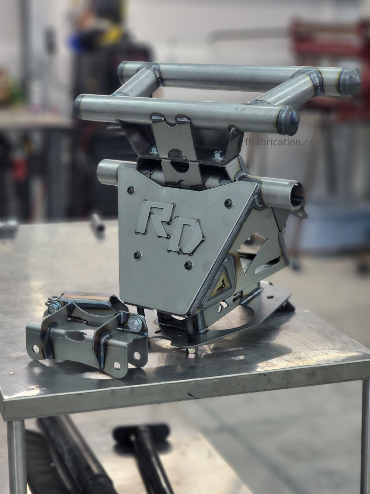 Metal mechanical component on a table with blurred background
