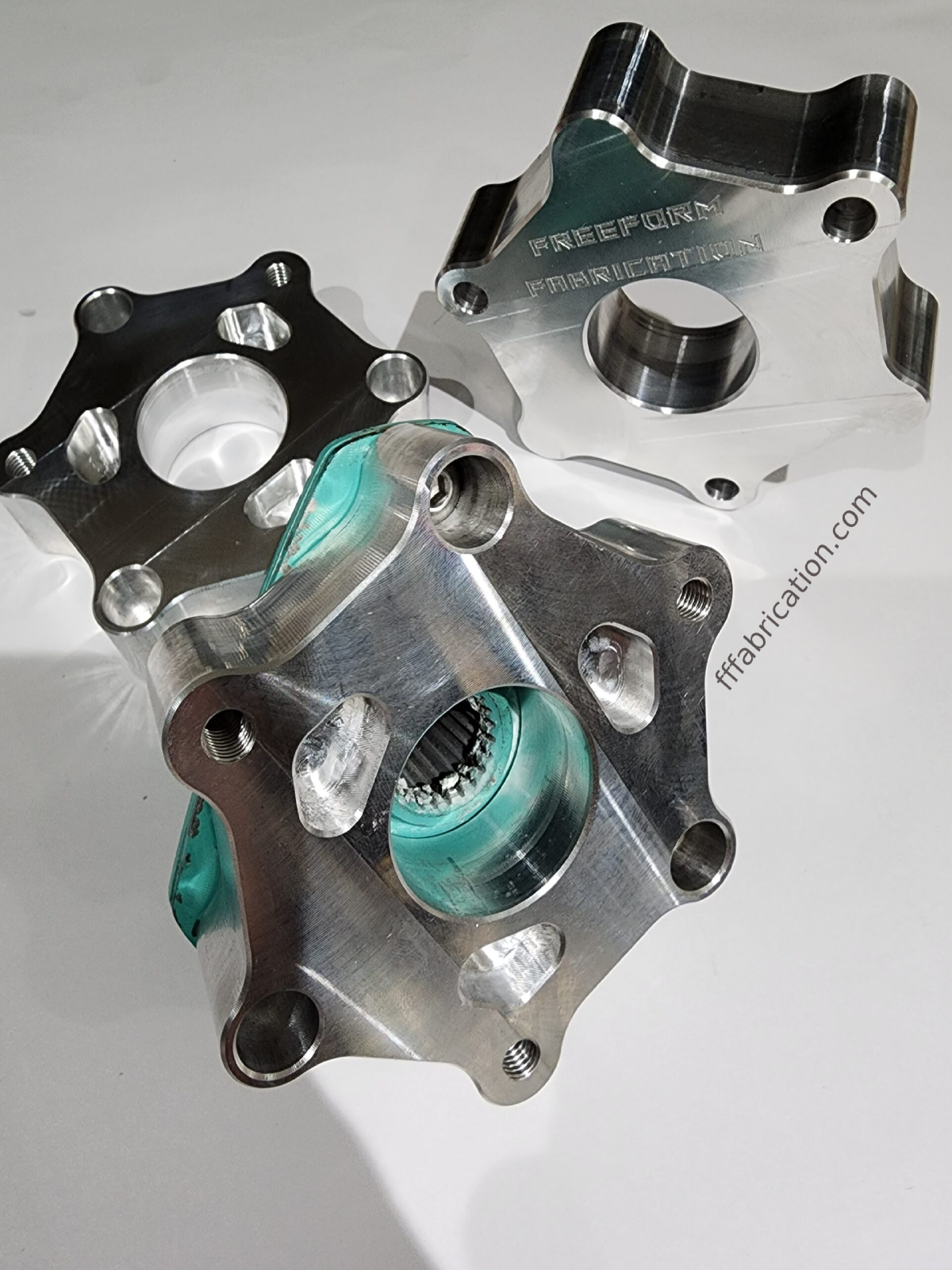 Metal mechanical component with 'Freeport-Miller' branding on a white background