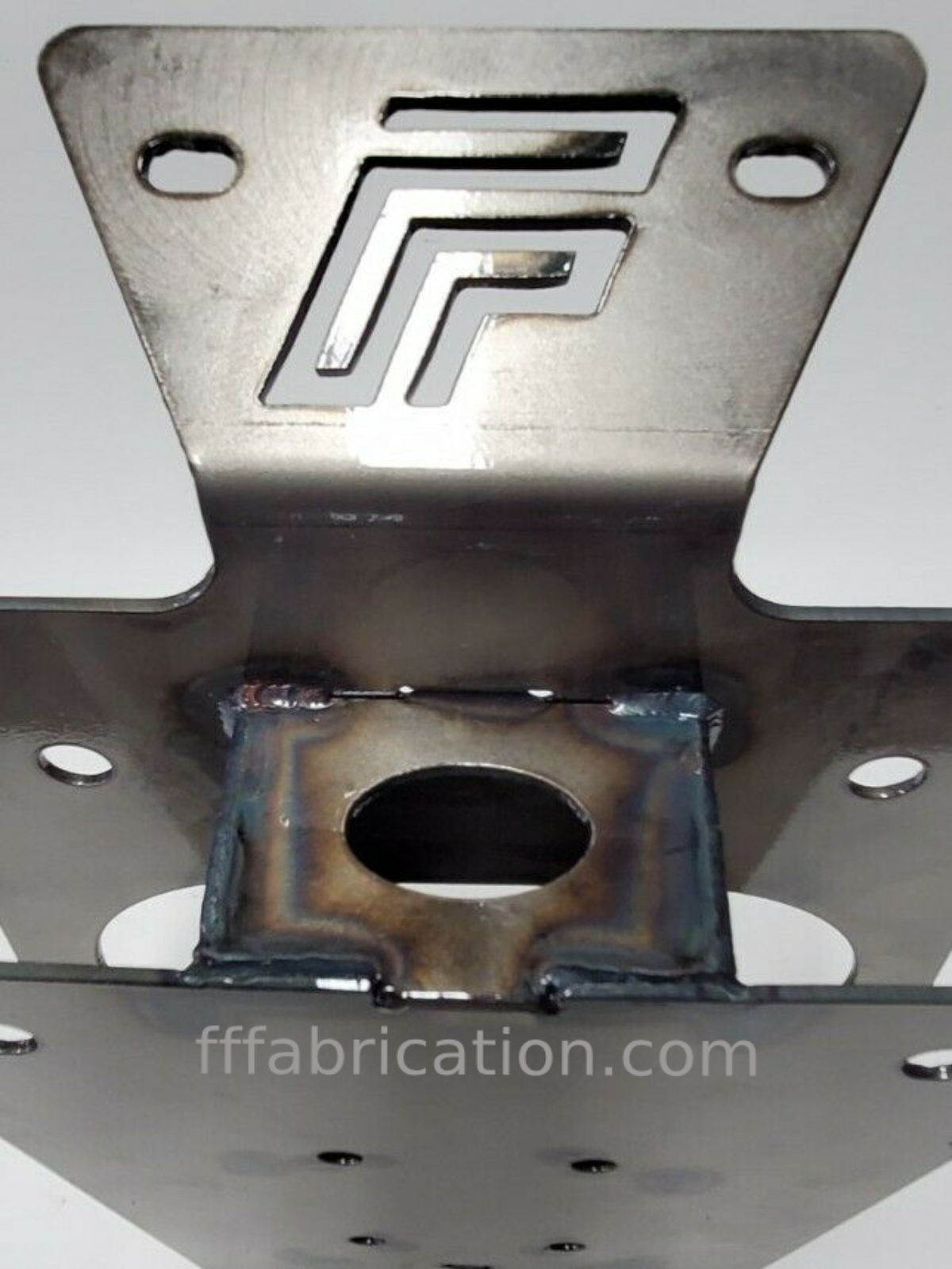 Metal fabrication component with geometric design on a gray background