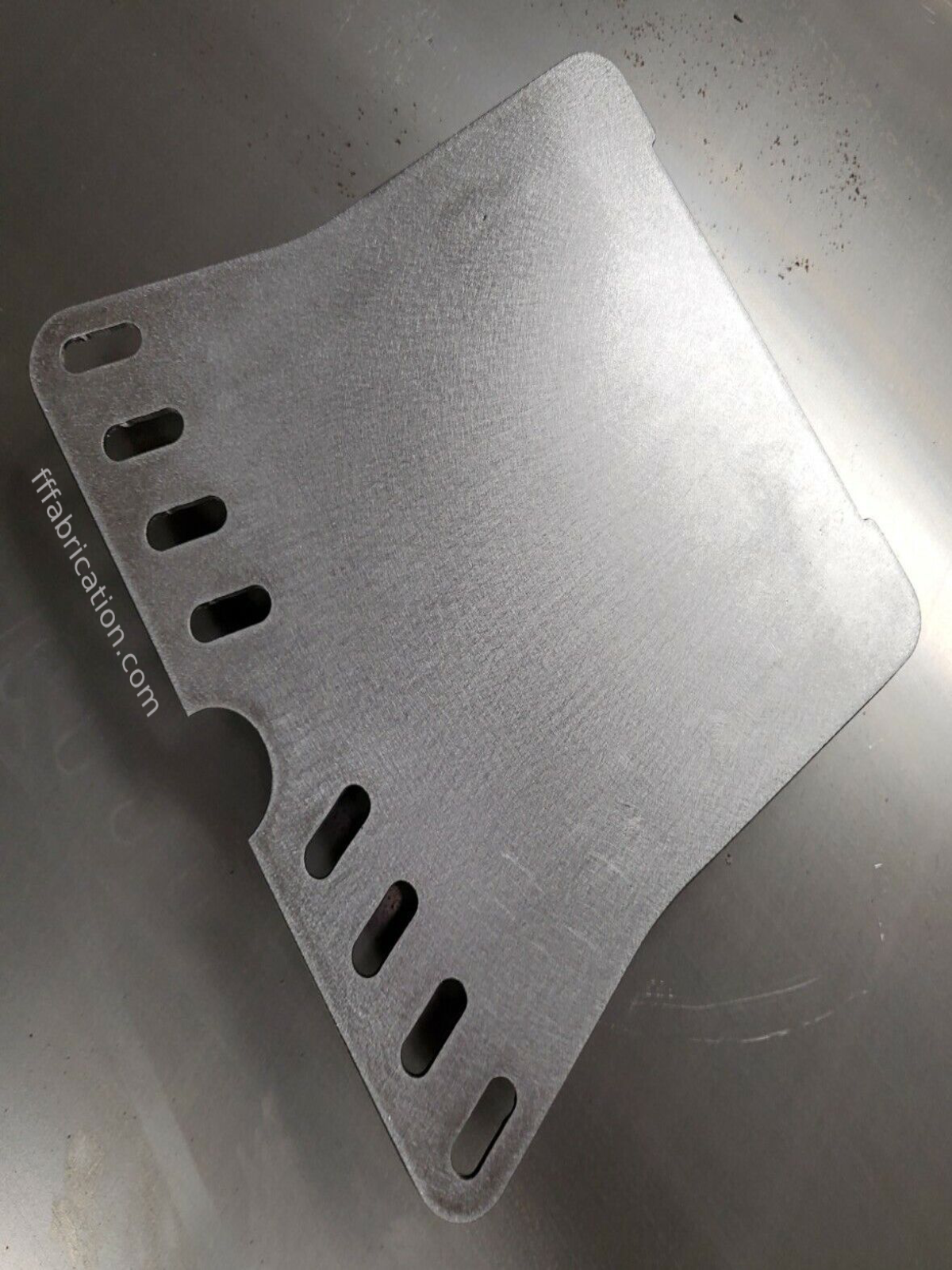 Metallic object with cut-out sections on a metallic surface