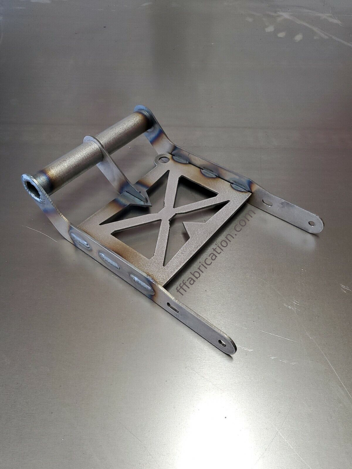 Metal bracket with star design on a metallic surface