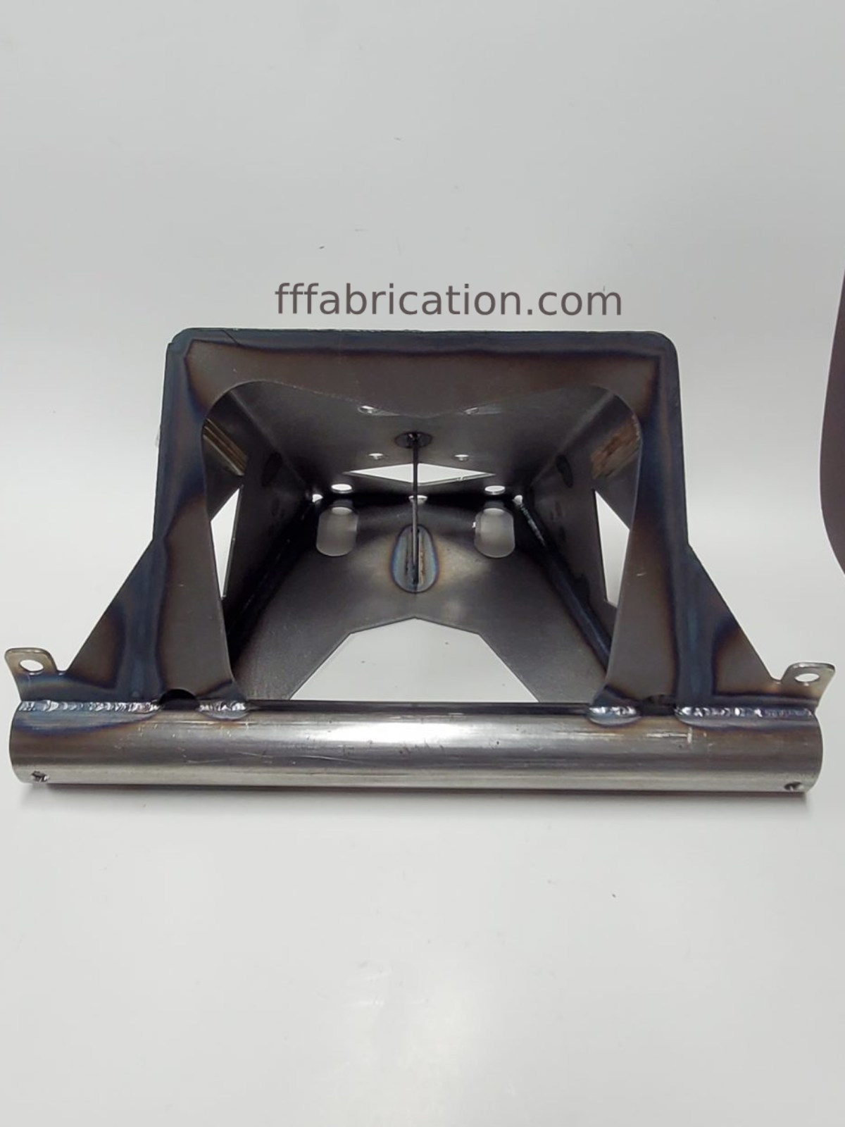 Metal fabrication component on a white background with 'fffabrication.com' text.